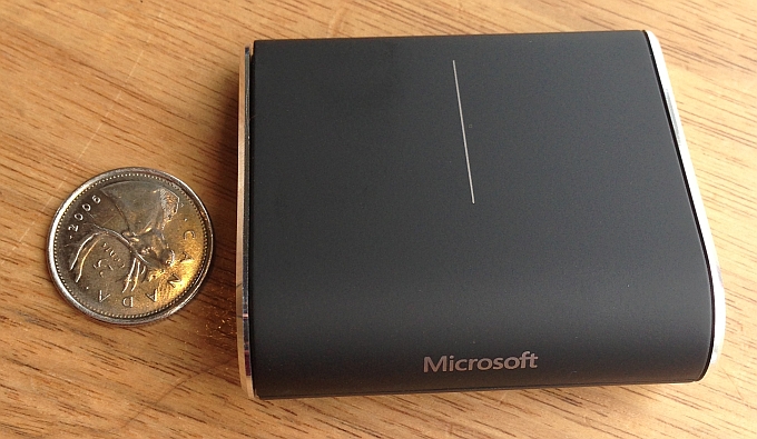 Microsoft Wedge Touch next to a quarter