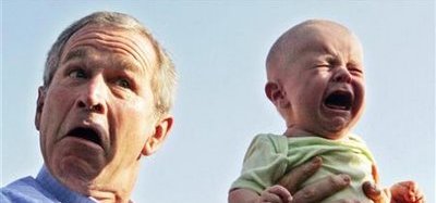George W. Bush Holding A Baby
