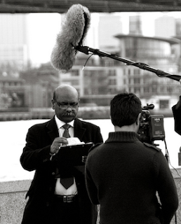 Newsman In Front Of Camera